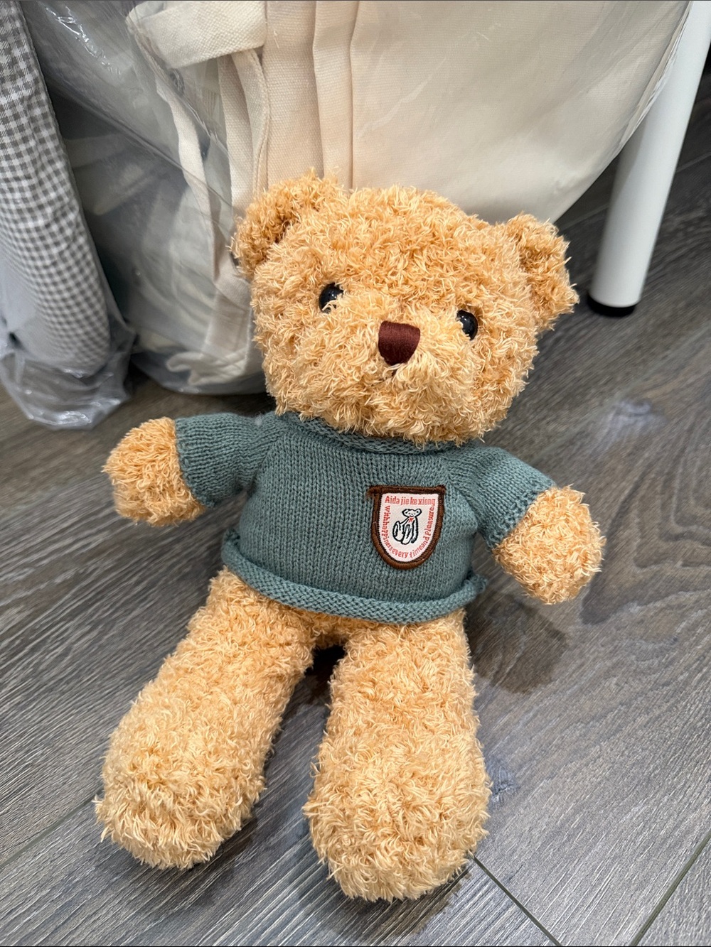 Plush Tan Teddy Bear with Sage Green Sweater